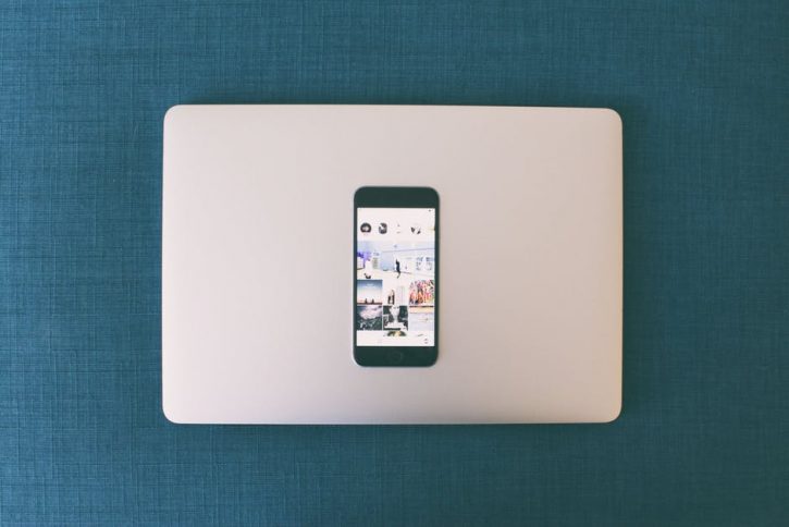 laptop image with phone on top